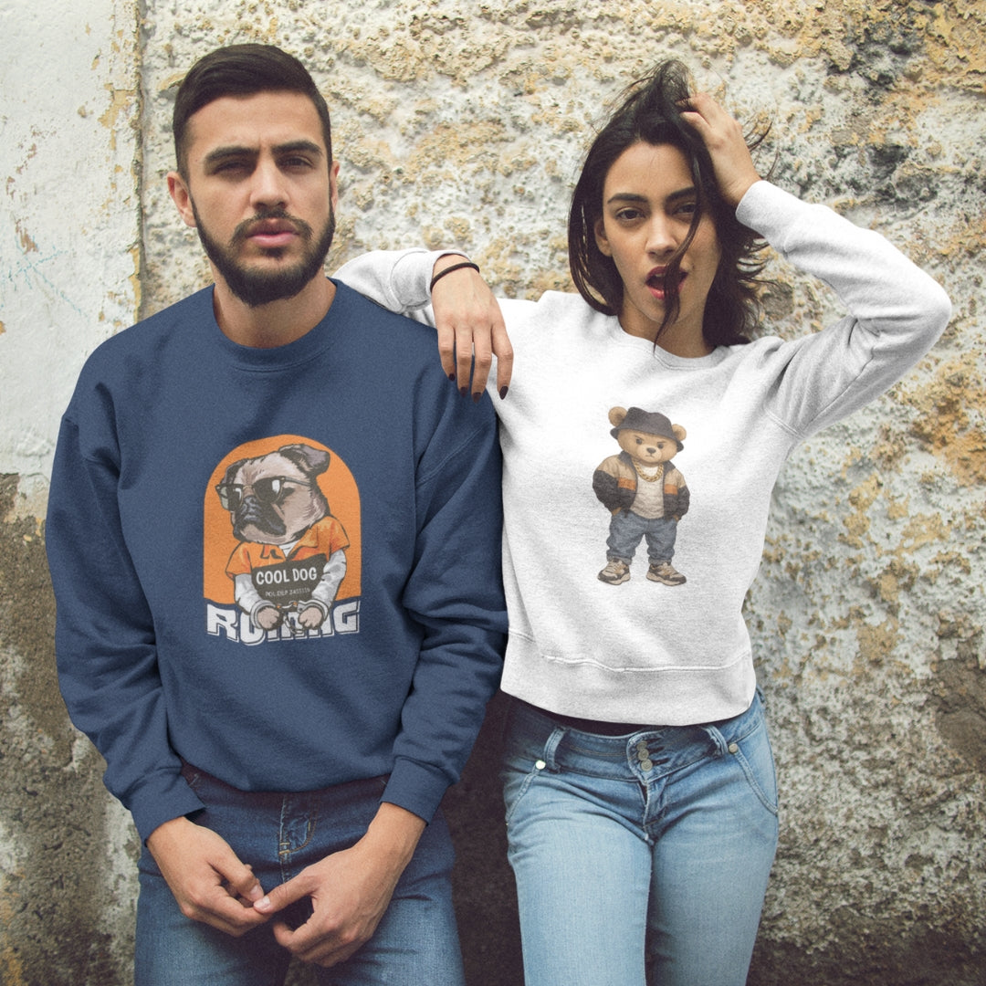 Two people wearing sweatshirts with animals graphic designs against a textured wall.